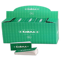 Karma Tips -paperitippivihko, jossa näkyy luonnonmukaisesta massasta valmistettuja filtteritippejä.