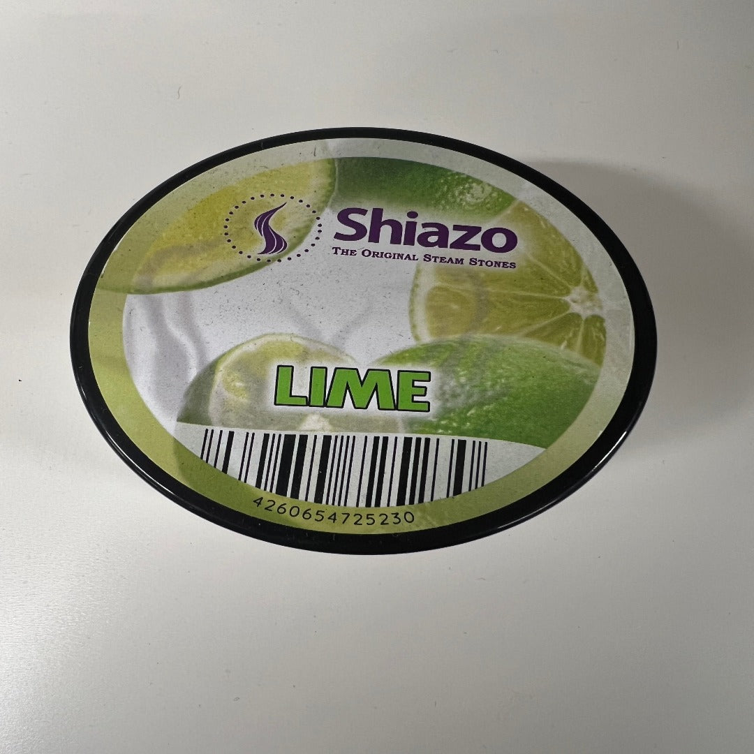 Kuva suljetusta Shiazo Höyrykivet Lime 100g -pakkauksesta, jossa on vihreä limen kuva ja runsaasti höyryä symboloivia elementtejä.